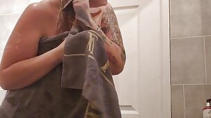 Hot Mom film's Herself getting out of the bath and getting ready